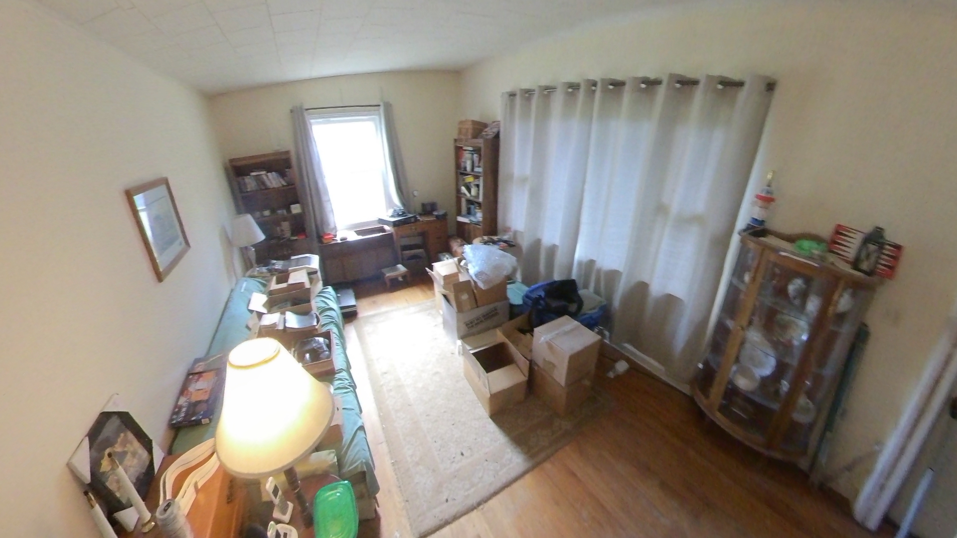 Cluttered living room before cleanout